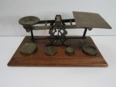 A set of Sampson Mordan postal scales & weights. Price guide £60-70.
