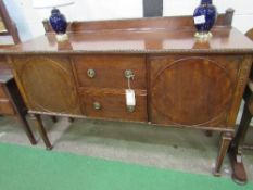 Mahogany sideboard on tapered legs with 2 central drawers, flanked by cupboards, 152cms x 51cms x