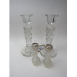 Pair of glass candlestick with a pair of silver rimmed bud vases