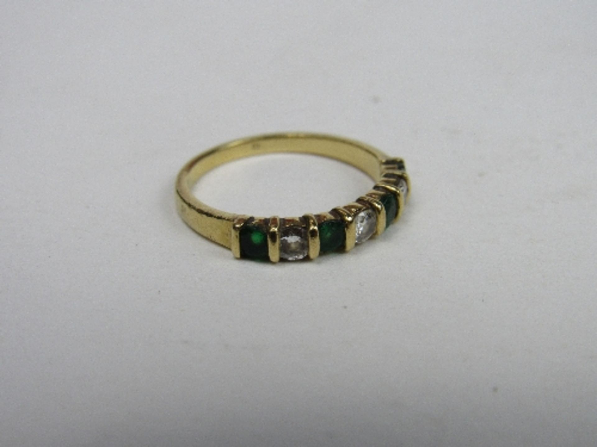 Gold ring set with emeralds & diamonds, weight 2.6gms, size L 1/2. Price guide £40-60.