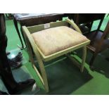 Green painted music stool with upholstered seat, 51cms x 40cms x 50cms. Price guide £10-20.