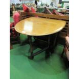 Oak gate-leg drop-side table, 150cms (open) x 105cms x 75cms. Price guide £50-80.