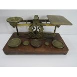 A set of Sampson Mordan postal scales & weights. Price guide £60-70.