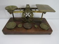 A set of Sampson Mordan postal scales & weights. Price guide £60-70.