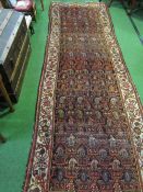 Persian design red ground runner, 370cms x 140cms