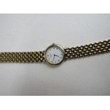 Seiko lady's wristwatch with yellow metal bracelet (not going)