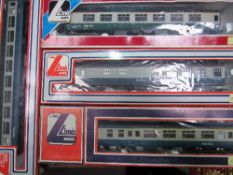 4 Lima coaches including buffet car. Price guide £25-35.