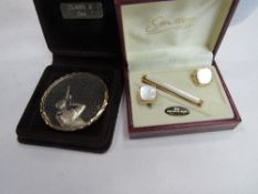 A shooting medal in case & a Stratton of London mother of pearl tiepin & cufflinks set. Price