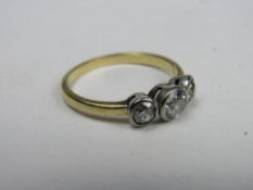 18ct gold & platinum ring with large central diamond flanked by 2 smaller diamonds, weight 4.2gms,
