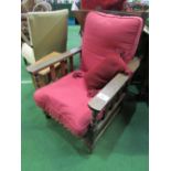 Easy reclining red upholstered chair & cushion. Price guide £20-40.