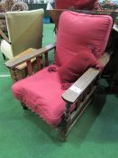 Easy reclining red upholstered chair & cushion. Price guide £20-40.