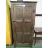 Oak single wardrobe with decorative hinges, 76cms x 51cms x 170cms. Price guide £20-30.