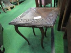 Oak carved triangular drop-side table. Price guide £5-10.