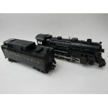 'O' gauge locomotive 'Lionel' c/w tender. Price guide £30-40.