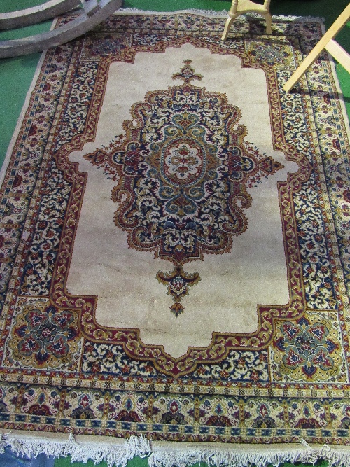 Beige ground carpet with centre medallion carpet, 230cms x 170cms