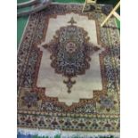 Beige ground carpet with centre medallion carpet, 230cms x 170cms