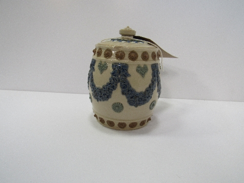 Royal Doulton silicon ware tobacco jar, decorated with swags. Original lid. Price guide £10-15.