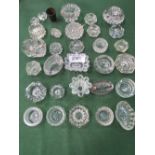 30 glass salt/trinket dishes & a pewter measure. Price guide £10-15.