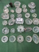30 glass salt/trinket dishes & a pewter measure. Price guide £10-15.