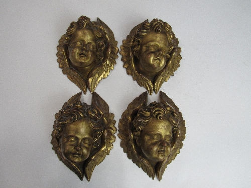 4 gilded cherub's faces. Price guide £80-100.