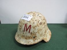 Spanish M26 'con ala' helmet circa 1930. Initials P.M. to front. Price guide £30-40.