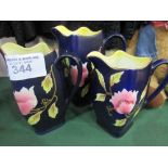 3 graduated jugs, blue with gold rims & flower pattern, 1920's/1930's. Price guide £15-20.