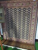 Blue ground Bokhara carpet, 2.30 x 1.60. Price guide £70-80.