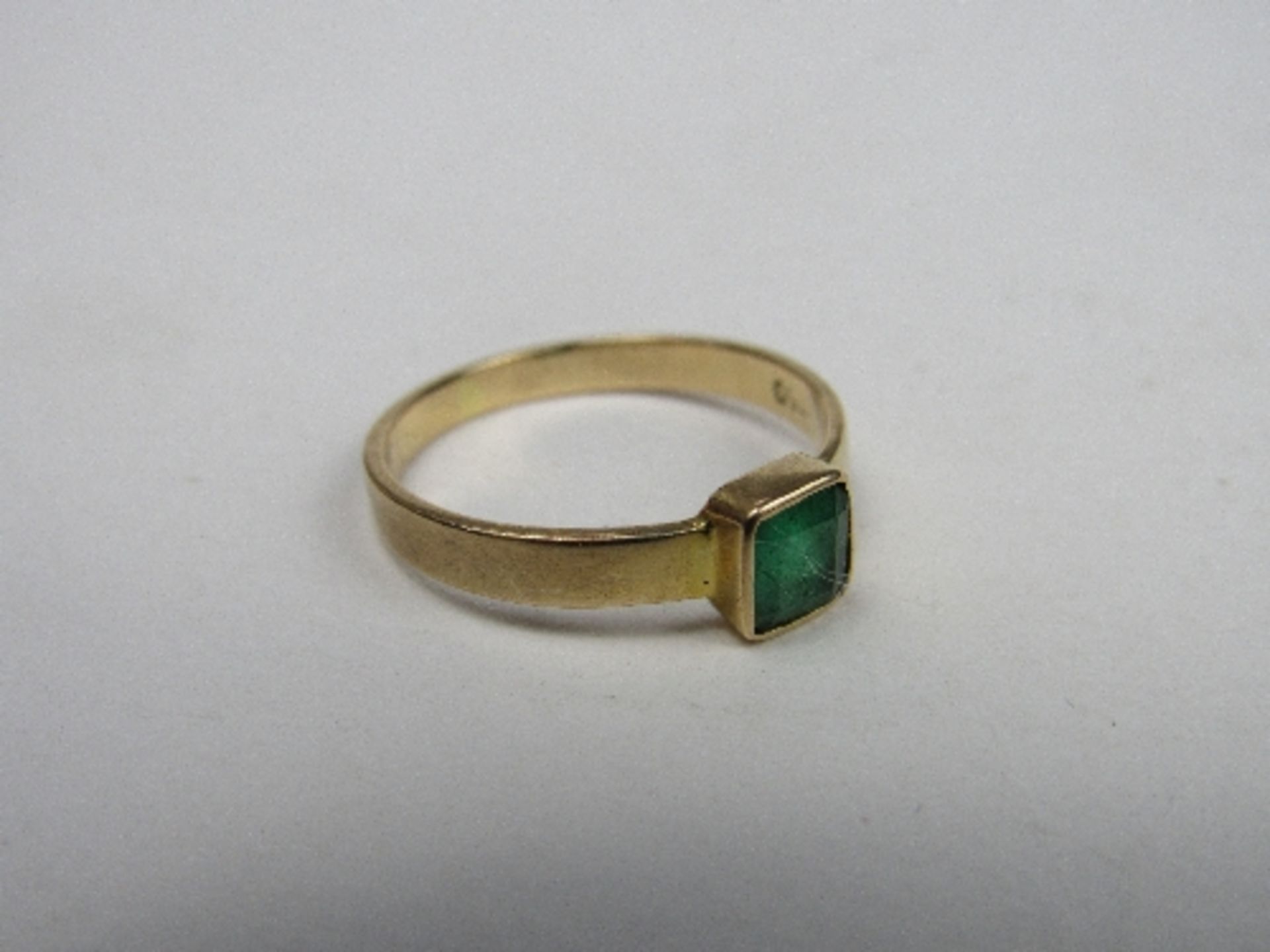 18ct gold ring with square green stone, weight 2.6gms, size O. Price guide £50-70.