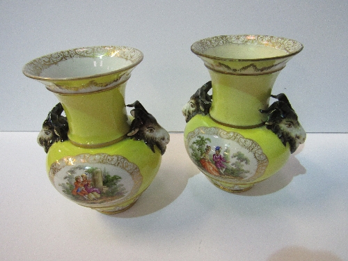 Pair of 19th century Berlin vases with goat head handles, decorated with scenes of lovers (1 goats