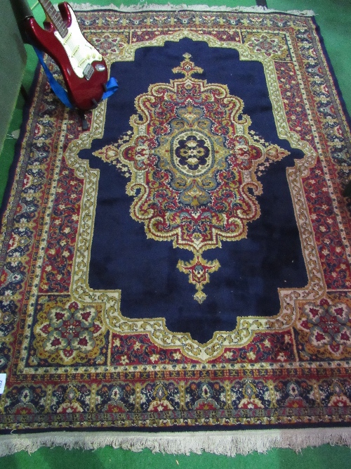 Blue ground carpet with centre medallion, 230cms x 170cms. Price guide £20-40.