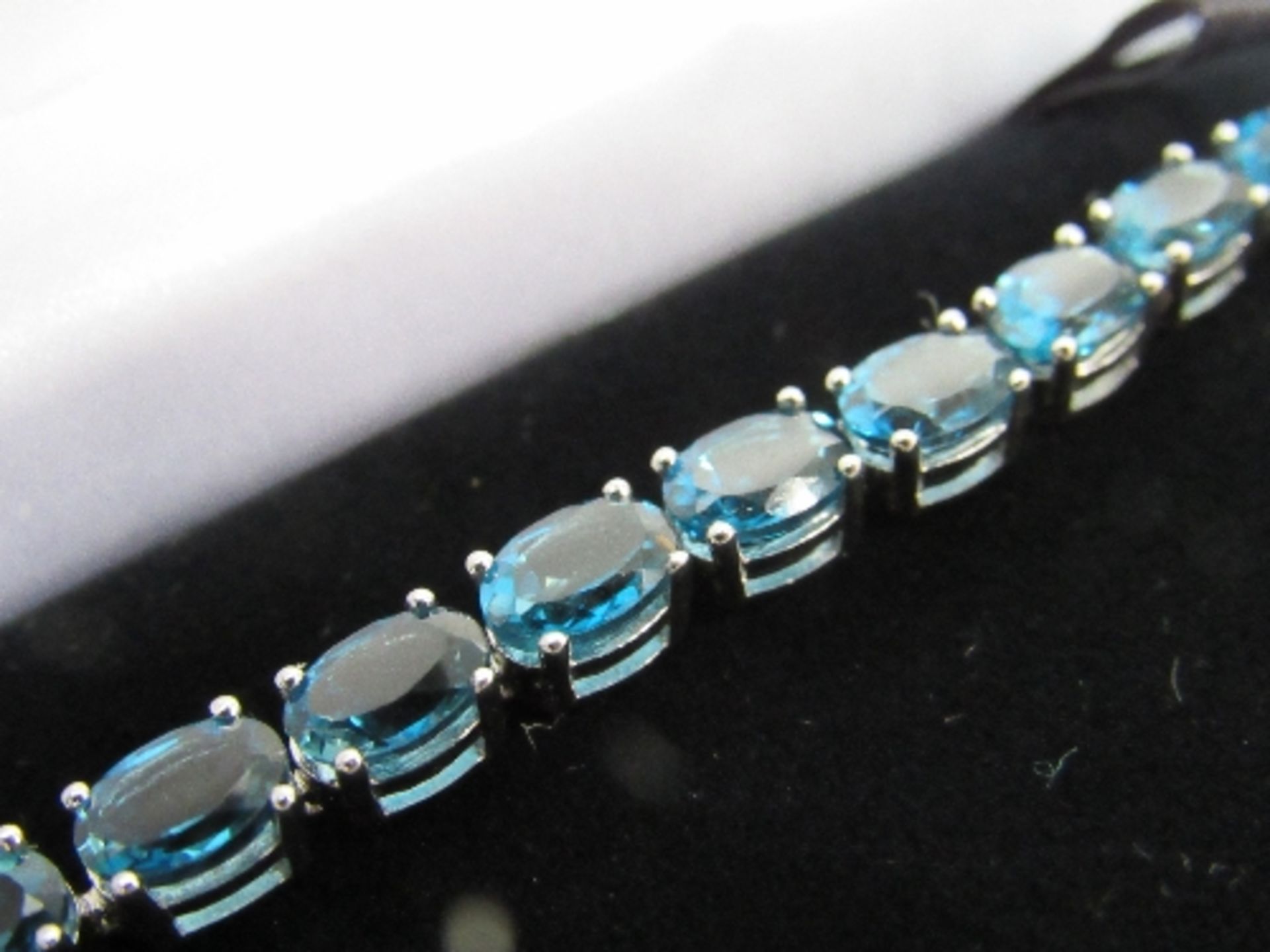 Lady's 925 sterling silver with aqua blue stones tennis bracelet. Price guide £15-20. - Image 2 of 2