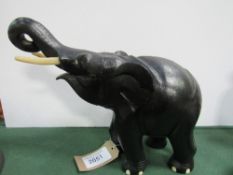 An ebony elephant. Price guide £20-30.