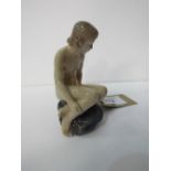 Royal Copenhagen nude girl on rocks. Price guide £40-50.