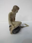 Royal Copenhagen nude girl on rocks. Price guide £40-50.