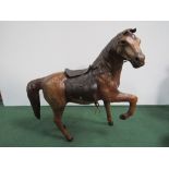 A leather model of a horse with saddle & bridle. Price guide £5-10.