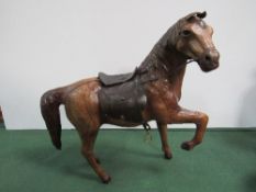 A leather model of a horse with saddle & bridle. Price guide £5-10.