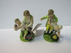 Rare pair of 18th century Staffordshire figures: 2 boys fighting over fruit (tip of thumb missing on