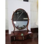 Inlaid mahogany oval shaped toilet mirror with 3 drawers to base. Price guide £20-30.