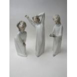 2 Lladro figurines of children & a Rosal figurine. Price guide £30-50.