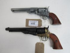 A silver coloured replica Colt revolver & a black revolver. Price guide £20-30.