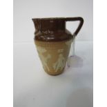 Doulton salt glazed jug with Egyptian sprig work decoration. Price guide £30-40.