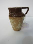 Doulton salt glazed jug with Egyptian sprig work decoration. Price guide £30-40.