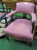 Pink upholstered open arm lady's drawing room chair. Price guide £30-40.