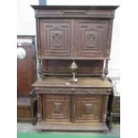 French carved oak dresser of 2 cupboards over 2 frieze drawers & double cupboard, 140cms x 56cms x