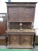 French carved oak dresser of 2 cupboards over 2 frieze drawers & double cupboard, 140cms x 56cms x