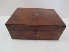 Mahogany writing slope with leather interior, working lock & key. Price guide £20-30.