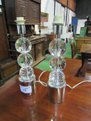 Pair of glass & chrome table lamps. Price guide £10-20.