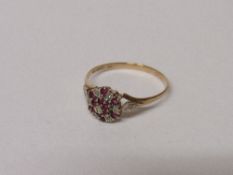 9ct gold floral setting of red & diamond ring, size W, 2 gms. Estimate £20-30.