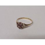 9ct gold floral setting of red & diamond ring, size W, 2 gms. Estimate £20-30.