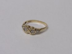 9ct gold ring set with diamonds in 2 entwined hearts, size U, 3 gms. Estimate £30-40.